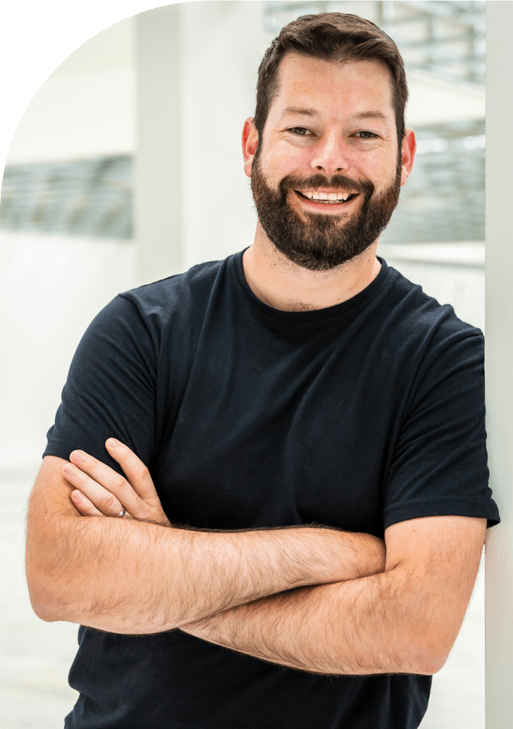 Man smiling next to WordPress monitoring platform