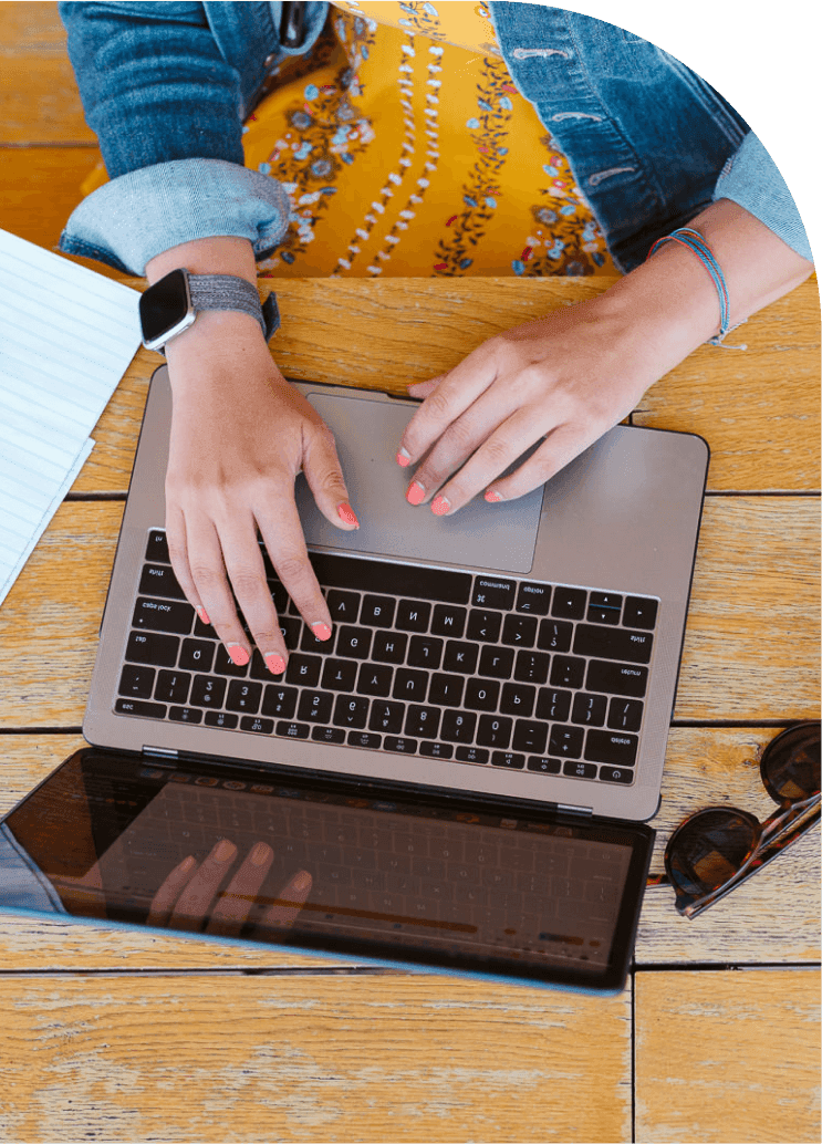 Photo of hands using a laptop