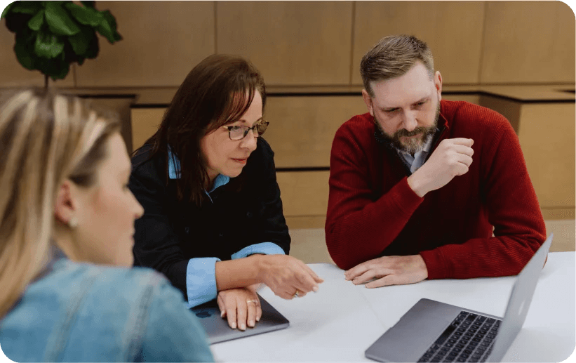 group of people looking at computer